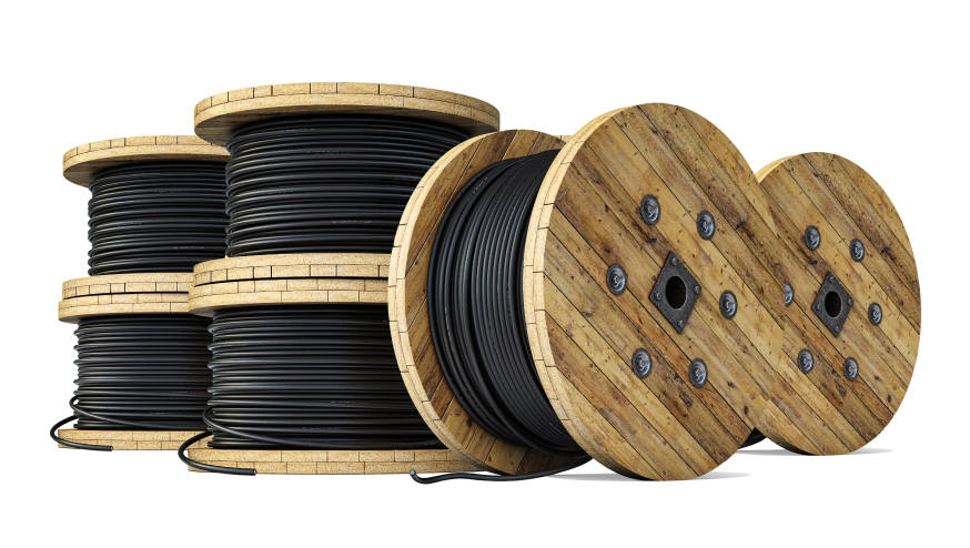Photograph of large spools of wire stacked.